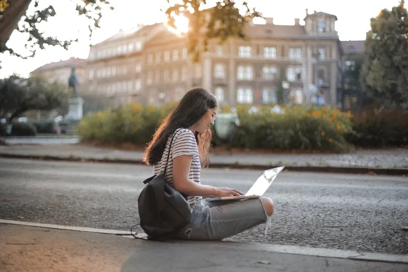 Woman putting her phone down to enjoy the present moment