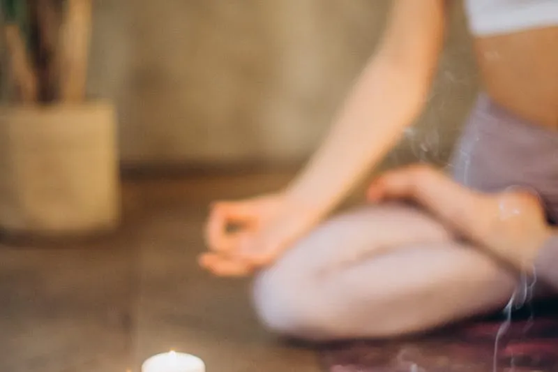 Woman with eyes closed practising conscious breathing