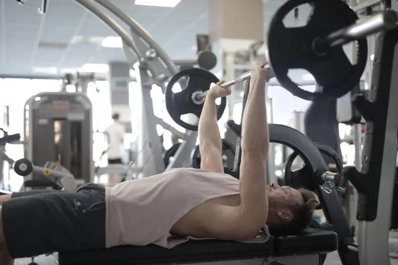 Woman adding plates to a barbell