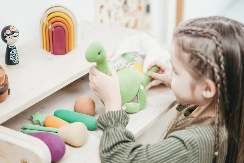 Pregnant woman in first trimester gently holding her belly