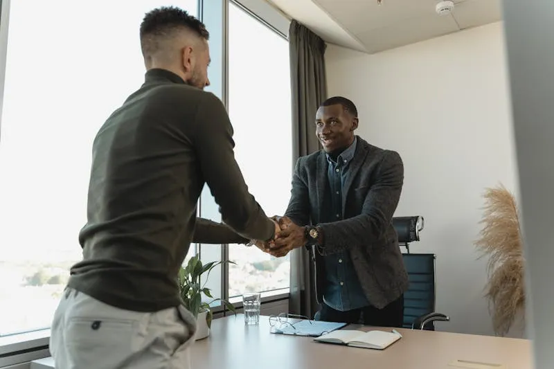 Senior woman in a professional meeting presenting her results with confidence to her manager to negotiate a promotion