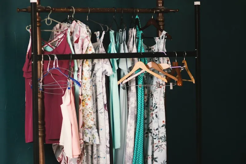 Organised wardrobe with clothes sorted by colour