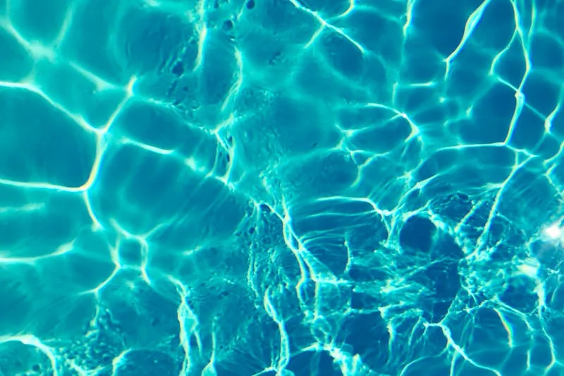Light reflections rippling through moving turquoise water