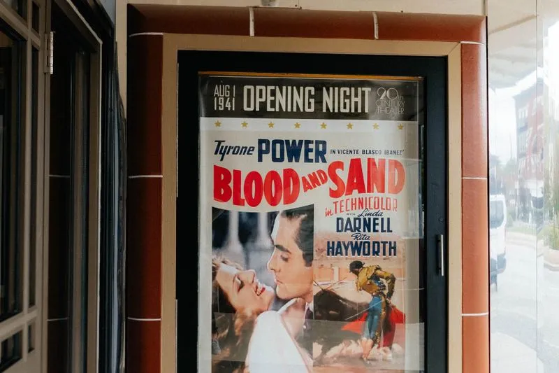 1941 poster for Blood and Sand displayed at a cinema entrance
