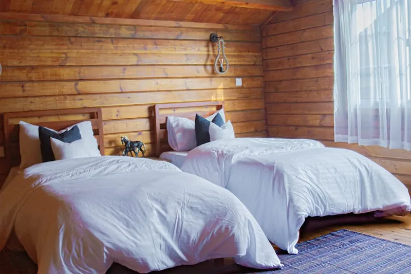 White percale cotton sheets on a bed with plush pillows