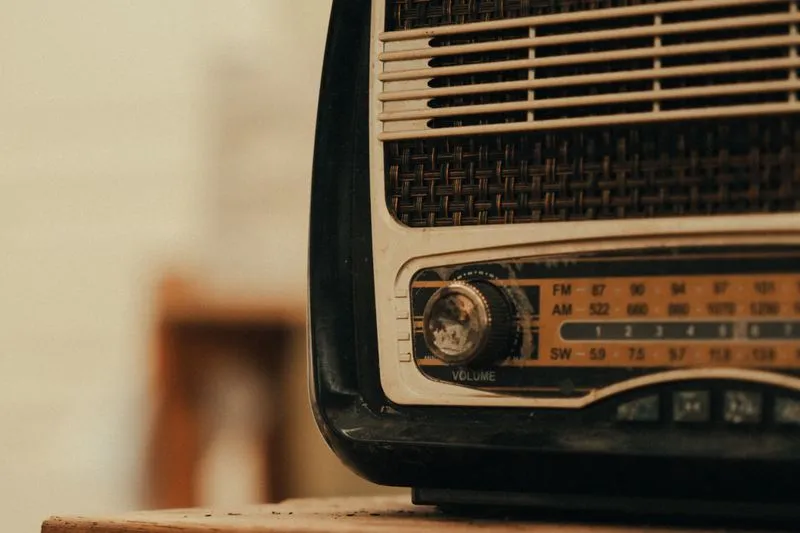 Close-up of a retro radio's FM/AM dial and volume knob
