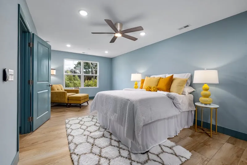 Bedroom with wall sconces on each side of the bed