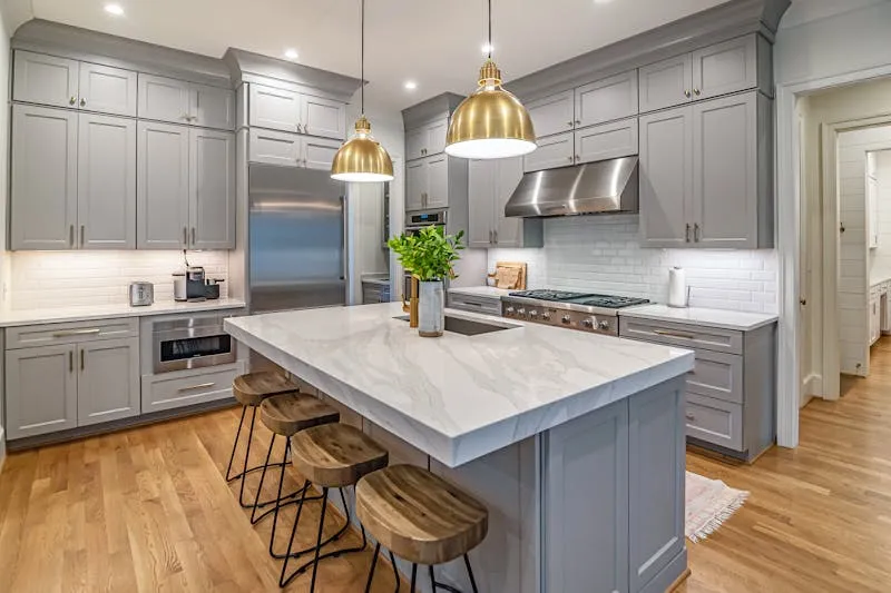 Kitchen with under-cabinet lighting and pendant lights above the island