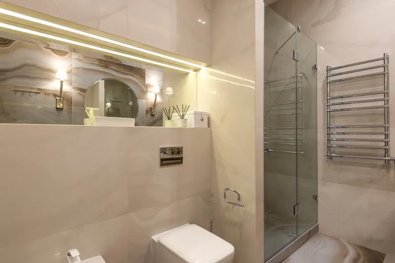Bathroom with vertical lighting on each side of the mirror