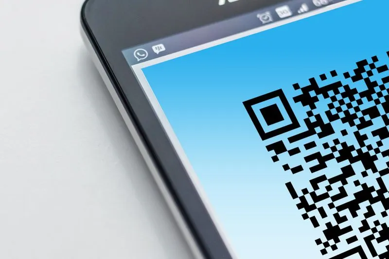 Close-up of a smartphone screen displaying a QR code