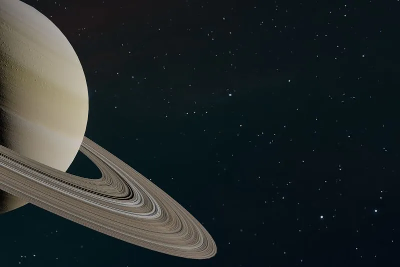 The planet Saturn and its rings in close-up, against a starry space background