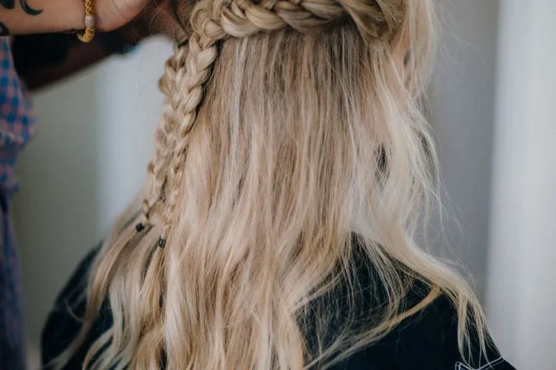 Back view of a plait starting near the crown and running down through blonde hair