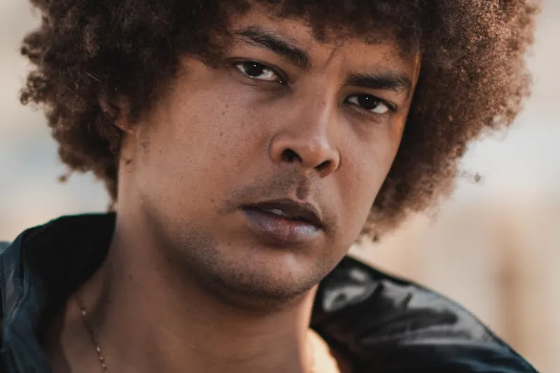 Minimalist bathroom shelf lined with organic cosmetic products