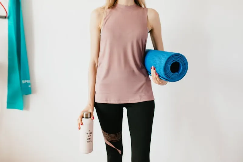 Woman exercising at home with a yoga mat