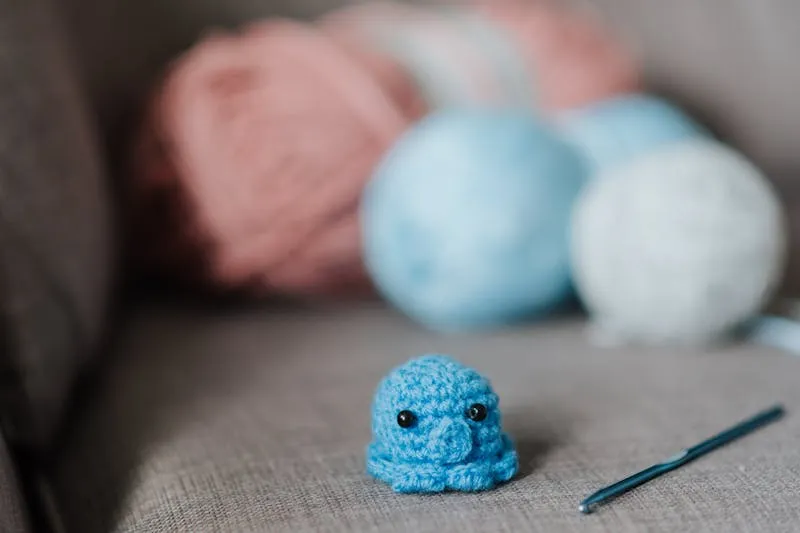 Cost-per-wear calculation in a notebook next to clothes