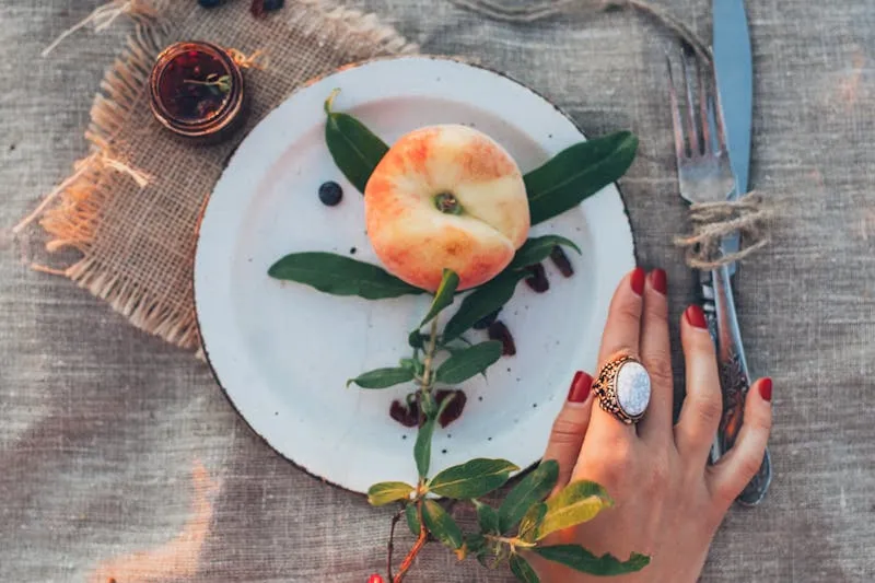 Large grazing board with cheeses, charcuterie and fruits