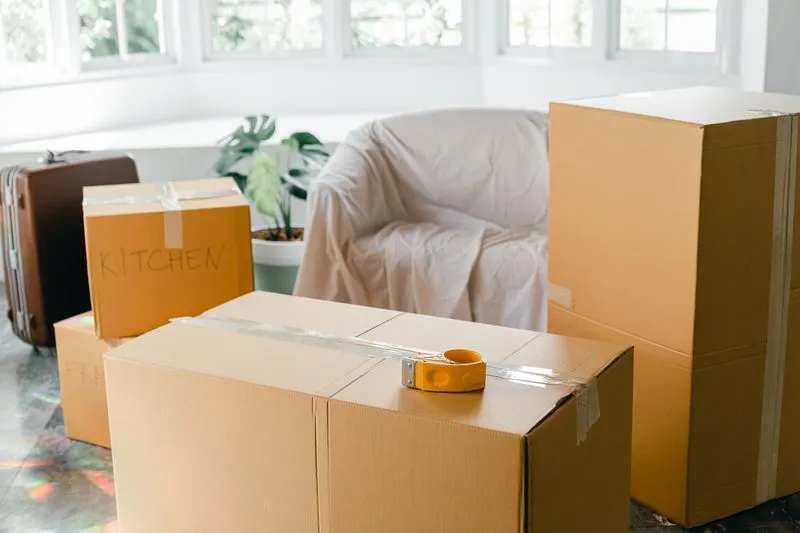 Stacked and labelled moving boxes in a flat on moving week