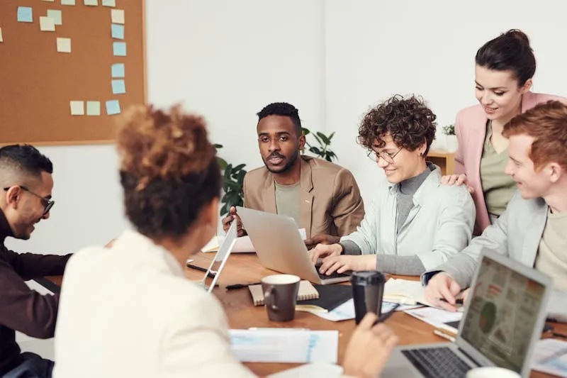 Mixed-gender team meeting in a modern conference room
