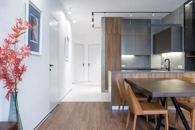 Functional small flat hallway with hooks and storage bench