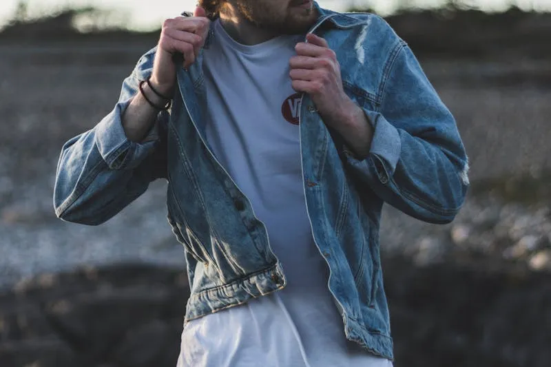 Oversized leather jacket worn with straight jeans